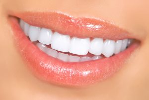 Smiling woman mouth with great teeth. Close up